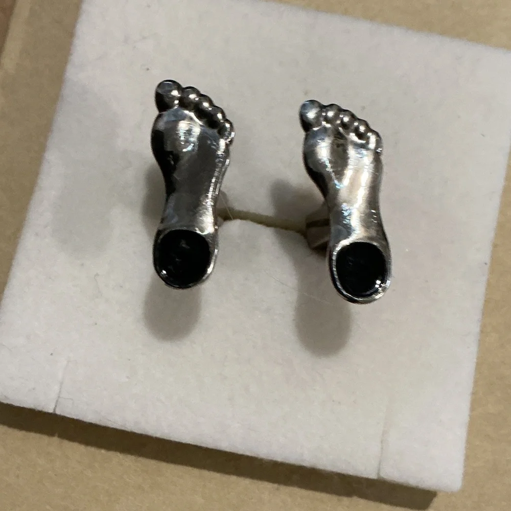 Rare set of Silver feet with onyx cuff links
